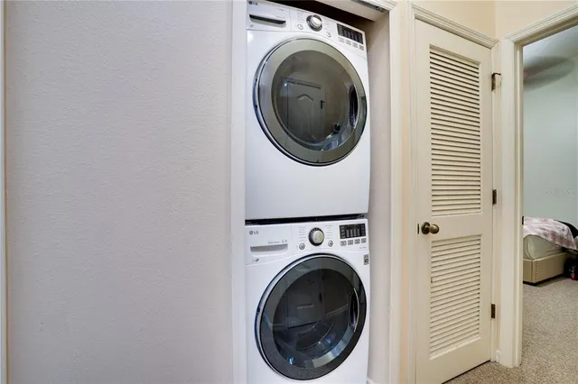 a view of a hallway with washer and dryer