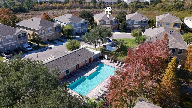an aerial view of house with yard