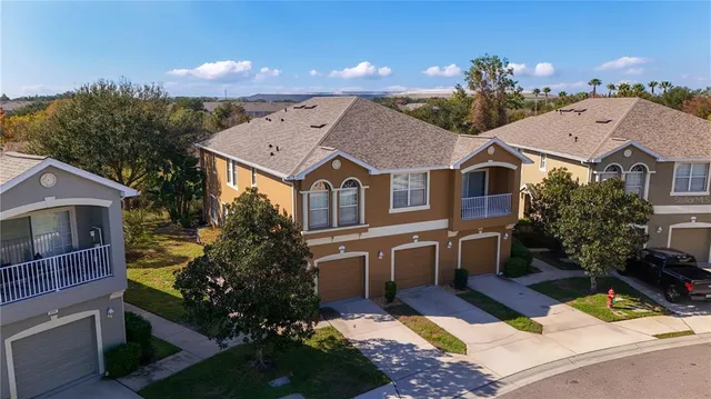 a aerial view of a house with a yard