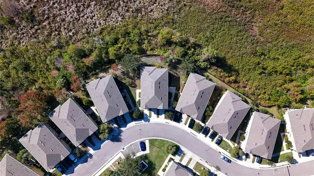 an aerial view of a house with outdoor space and sitting space