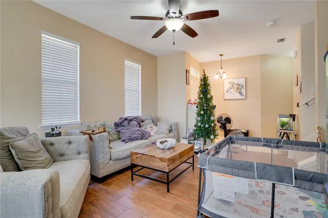 a living room with furniture and a large window