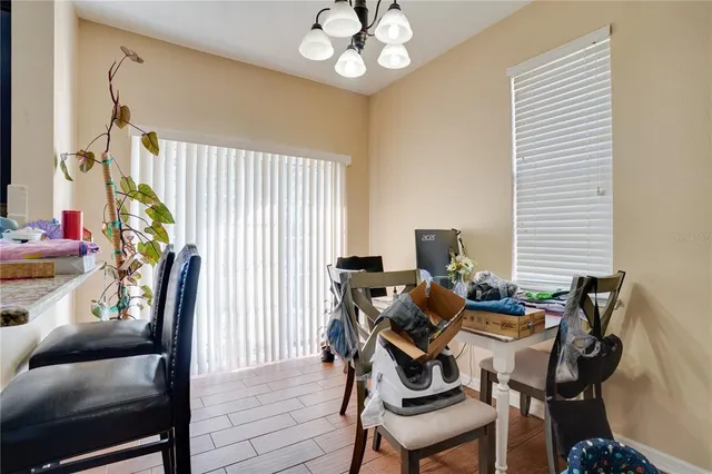 a dining room with furniture and window