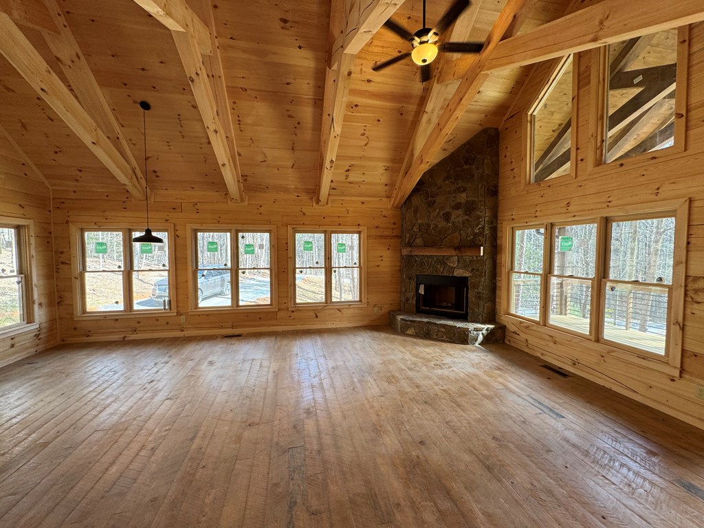 639 North Moreland Drive Blue Ridge, GA 30513 - Photo 3 of 53 a view of an empty room with wooden floor and a window