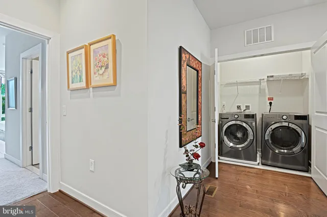 a view of a hallway with washer and dryer