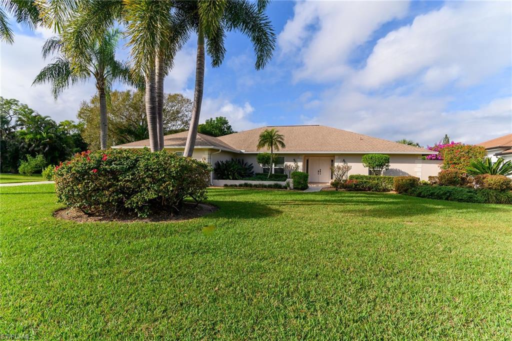 1916 Countess Court Naples, FL 34110 - Photo 1 of 43 a view of a garden