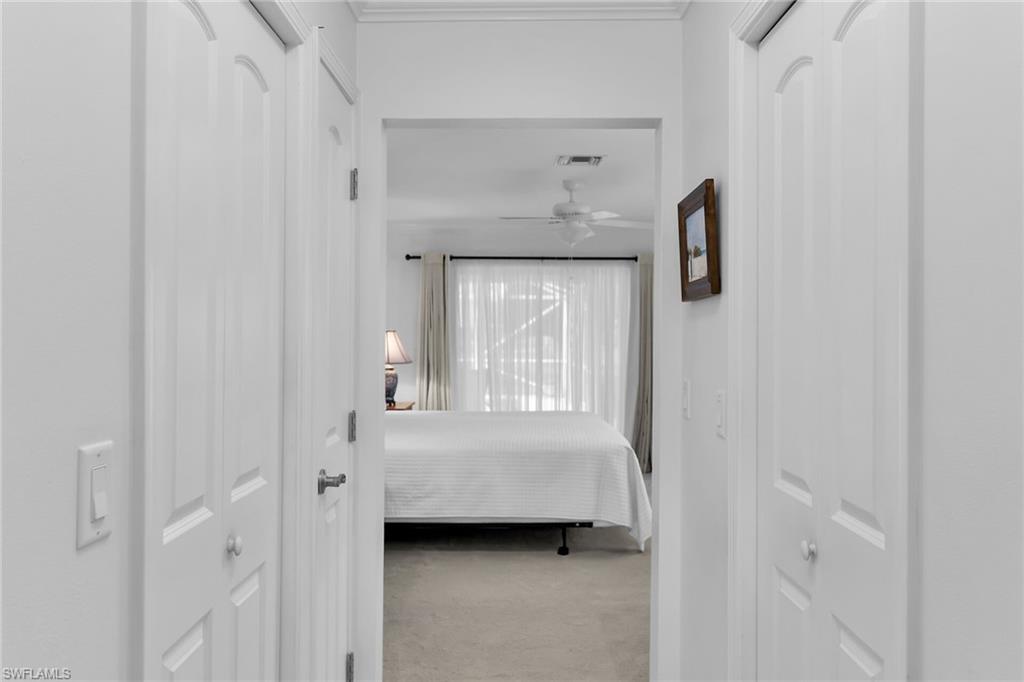 1916 Countess Court Naples, FL 34110 - Photo 21 of 43 a view of room with cabinet and mirror