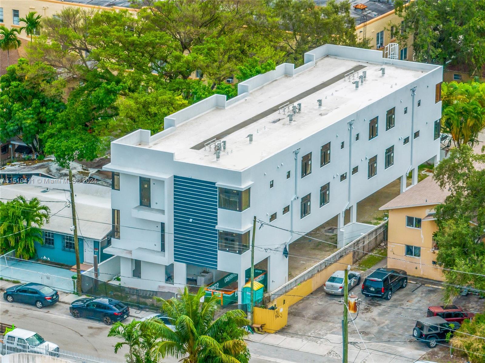 526 Southwest 2nd Street Miami, FL 33130 - Photo 17 of 22 a large building with a small yard and large trees