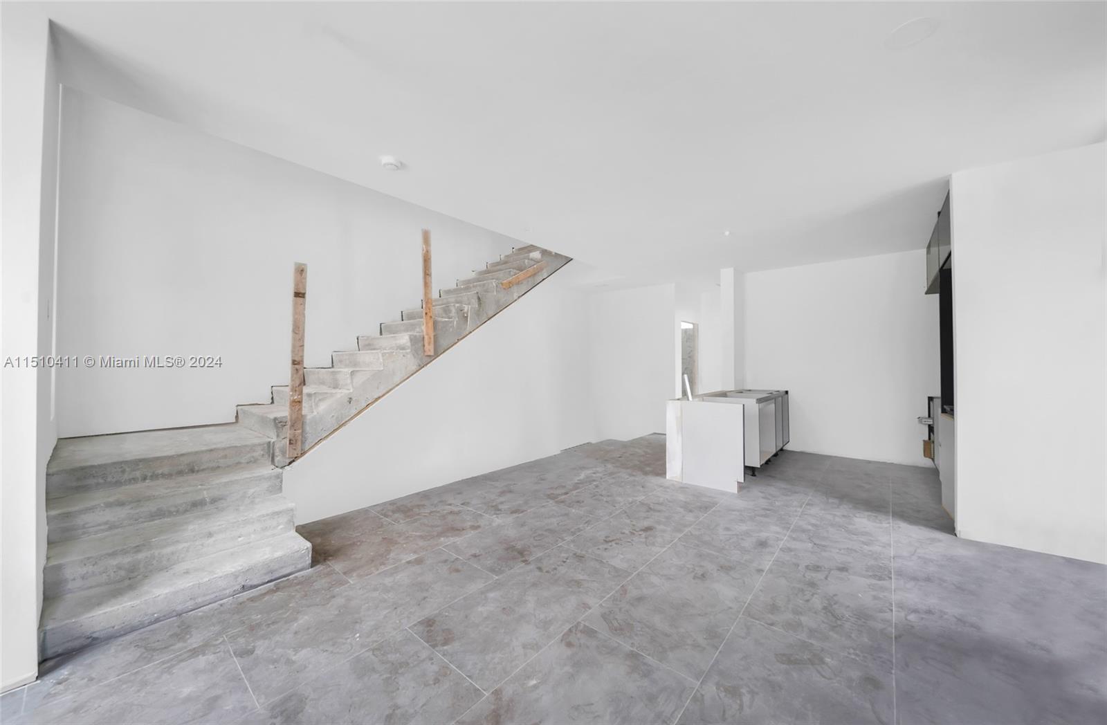 526 Southwest 2nd Street Miami, FL 33130 - Photo 3 of 22 a view of an empty room with stairs