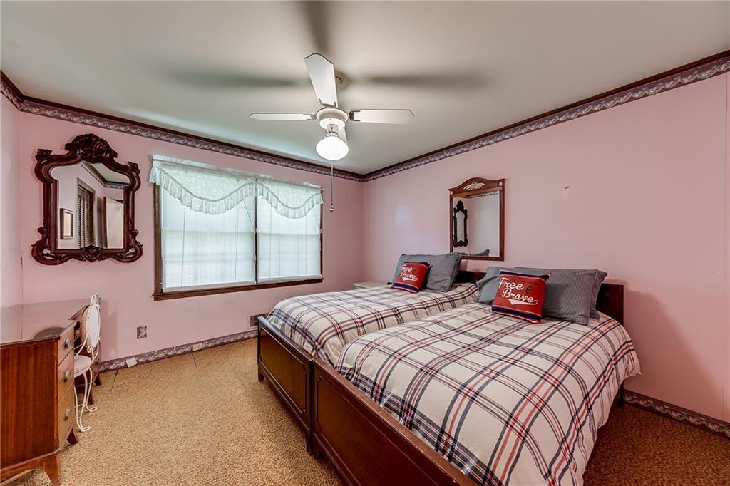 6223 Hulsey Road Clermont, GA 30527 - Photo 23 of 53 a bedroom with a bed dresser and window