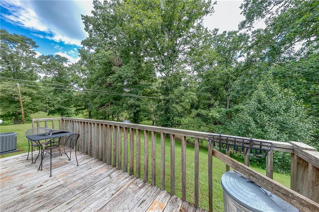 6223 Hulsey Road Clermont, GA 30527 - Photo 30 of 53 a balcony with wooden floor and outdoor space