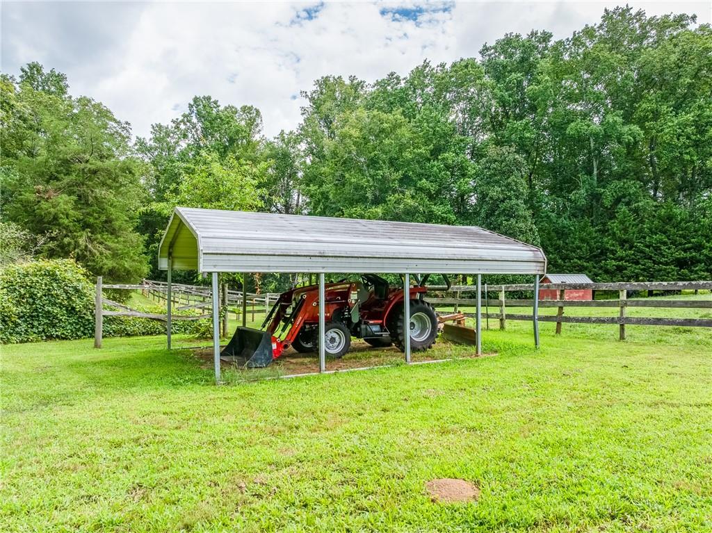 6223 Hulsey Road Clermont, GA 30527 - Photo 31 of 53 a view of a wooden deck and a yard