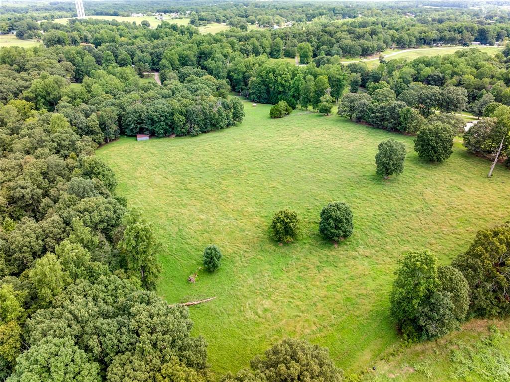 6223 Hulsey Road Clermont, GA 30527 - Photo 33 of 53 a view of a garden with a building in the background