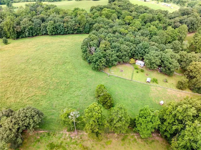 a view of a garden with a building