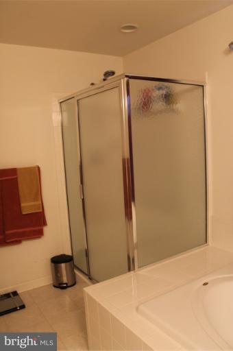 9 Boise Road Inwood, WV 25428 - Photo 14 of 30 a bathroom with a shower and a sink
