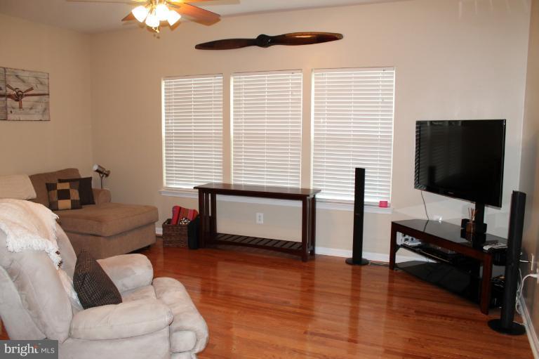 9 Boise Road Inwood, WV 25428 - Photo 3 of 30 a living room with furniture and a flat screen tv