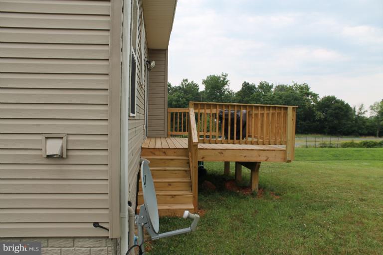 9 Boise Road Inwood, WV 25428 - Photo 23 of 30 a backyard of a house with table and chairs