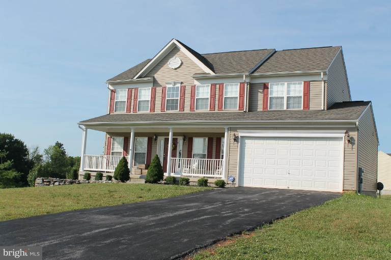 9 Boise Road Inwood, WV 25428 - Photo 29 of 30 a front view of a house with a yard and garage