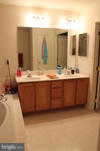 9 Boise Road Inwood, WV 25428 - Photo 4 of 30 a bathroom with a sink and a mirror