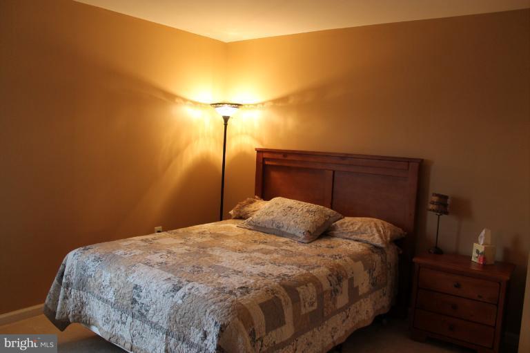 9 Boise Road Inwood, WV 25428 - Photo 5 of 30 a bedroom with a bed and a night stand