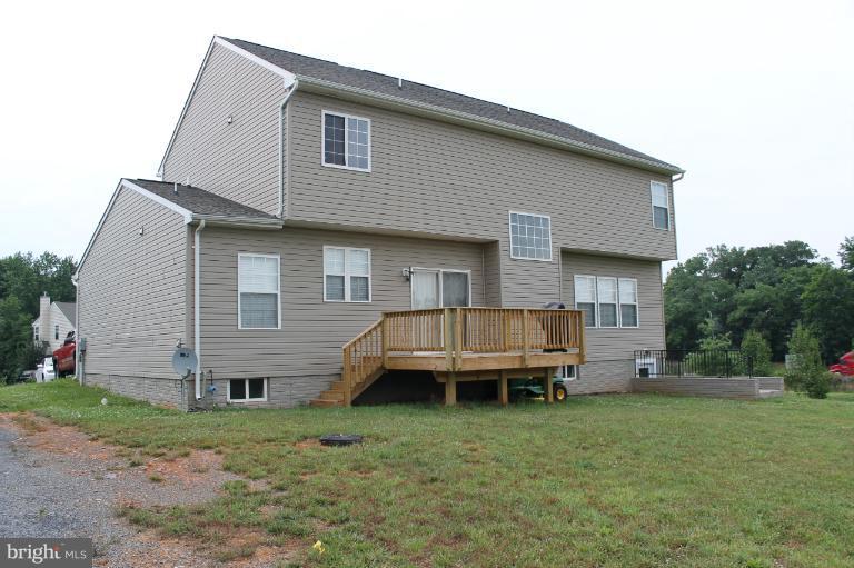 9 Boise Road Inwood, WV 25428 - Photo 6 of 30 a backyard of a house