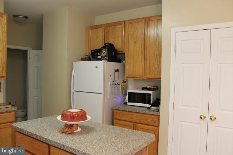 9 Boise Road Inwood, WV 25428 - Photo 9 of 30 a kitchen with a refrigerator and a stove