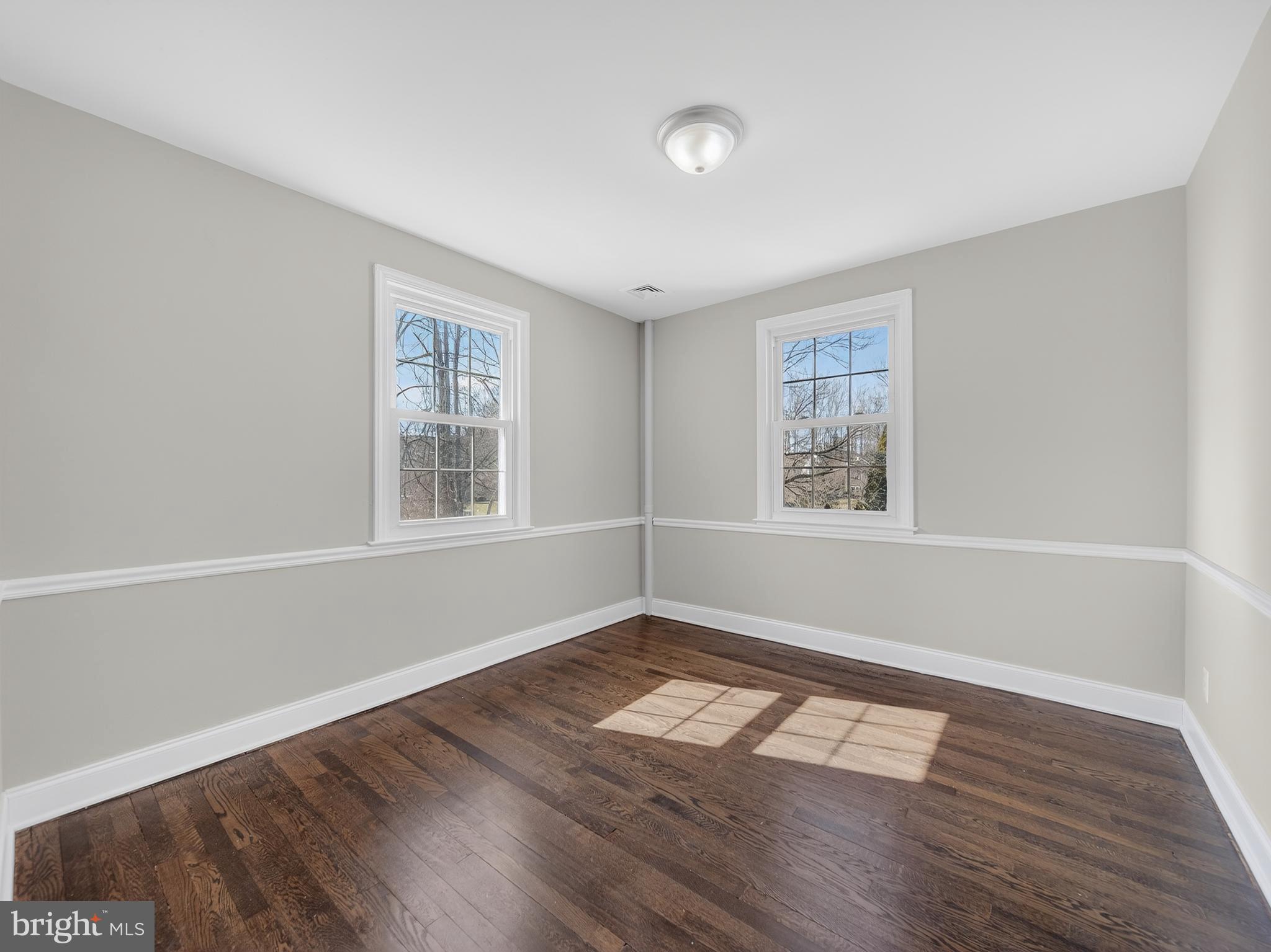 1815 Bonifant Road Silver Spring, MD 20906 - Photo 13 of 49 a view of empty room with wooden floor and fan