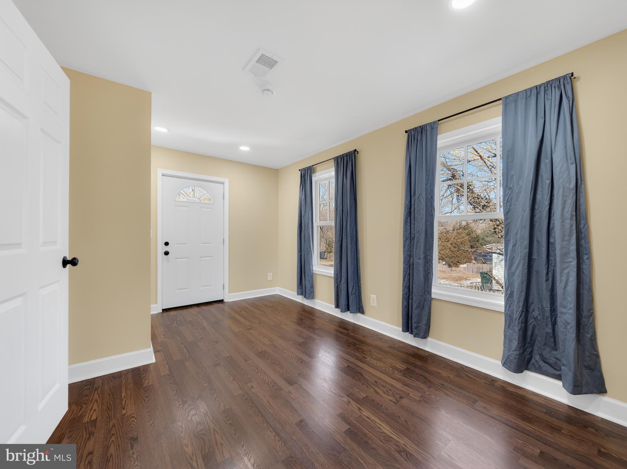 1815 Bonifant Road Silver Spring, MD 20906 - Photo 16 of 49 a view of an empty room with wooden floor and a window