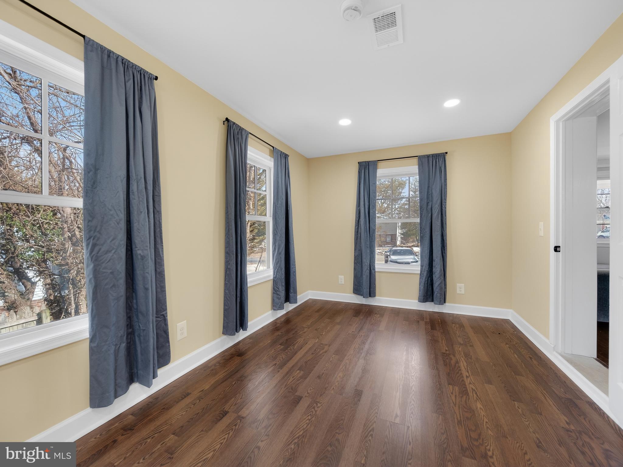 1815 Bonifant Road Silver Spring, MD 20906 - Photo 18 of 49 a view of a hallway with wooden floor and a window