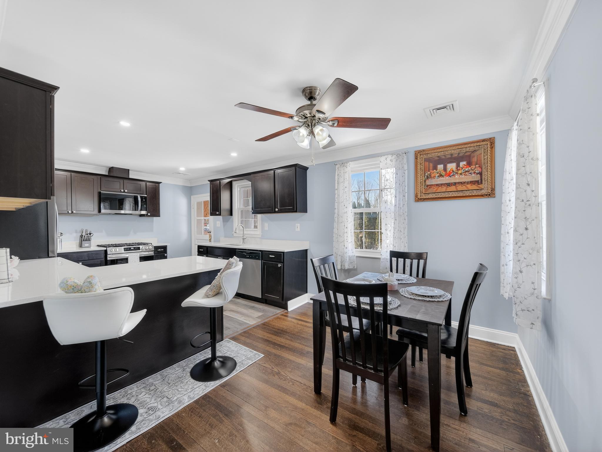 1815 Bonifant Road Silver Spring, MD 20906 - Photo 19 of 49 a view of a dining room with furniture and wooden floor