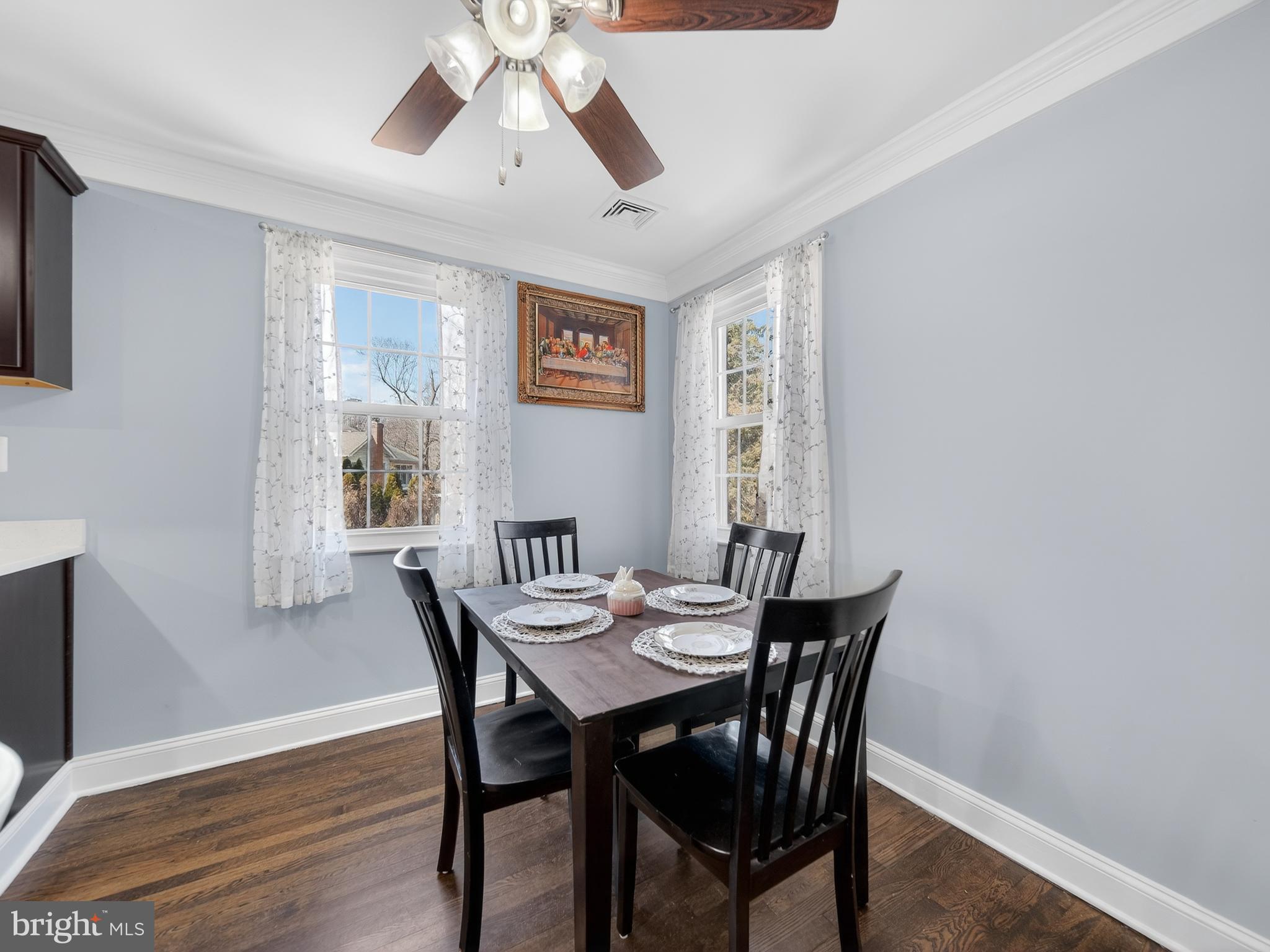 1815 Bonifant Road Silver Spring, MD 20906 - Photo 20 of 49 a view of a dining room with furniture window and wooden floor