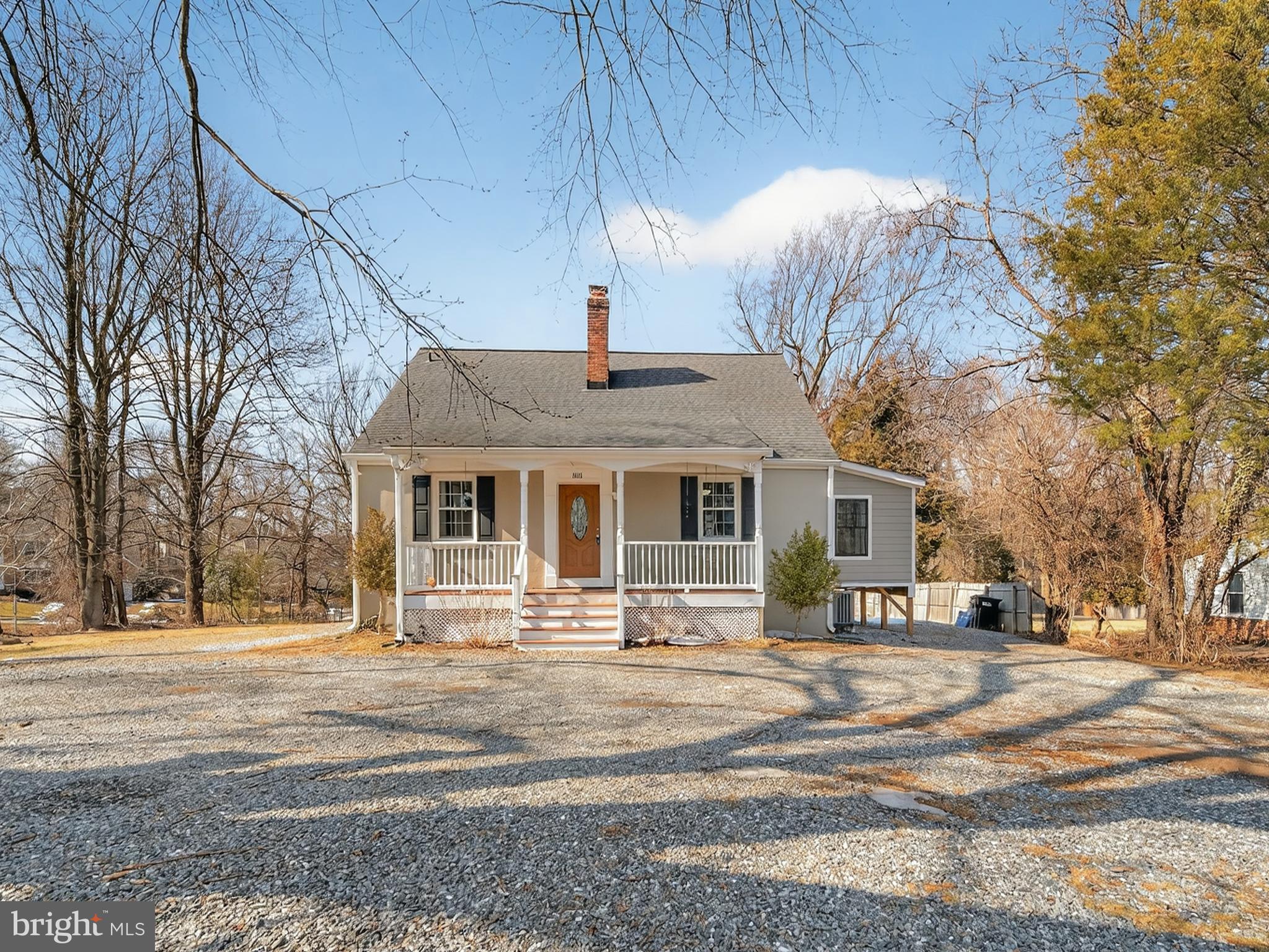 1815 Bonifant Road Silver Spring, MD 20906 - Photo 2 of 49 a front view of a building with street and trees