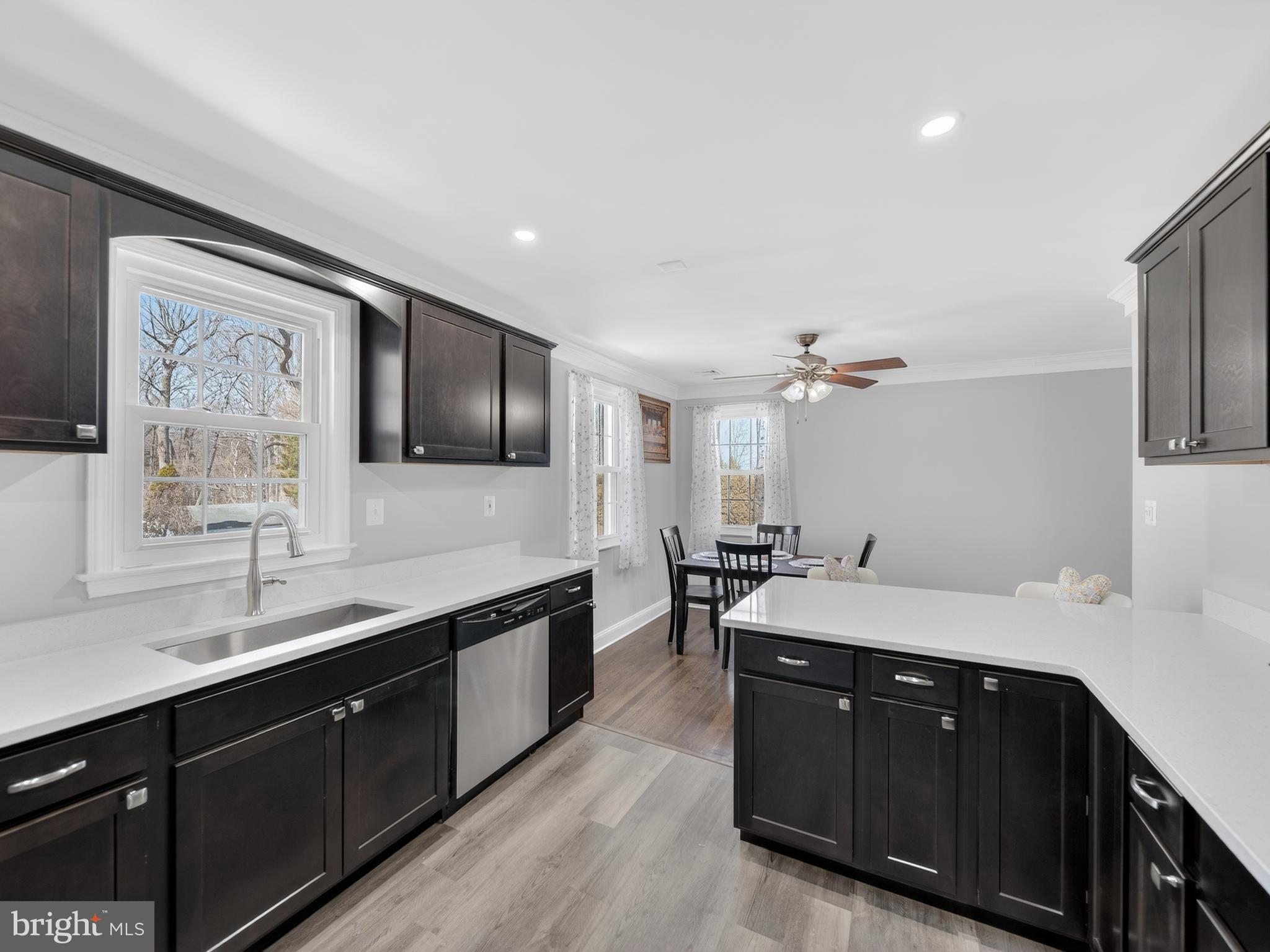 1815 Bonifant Road Silver Spring, MD 20906 - Photo 25 of 49 a spacious bathroom with a granite countertop sink a toilet a mirror and shower