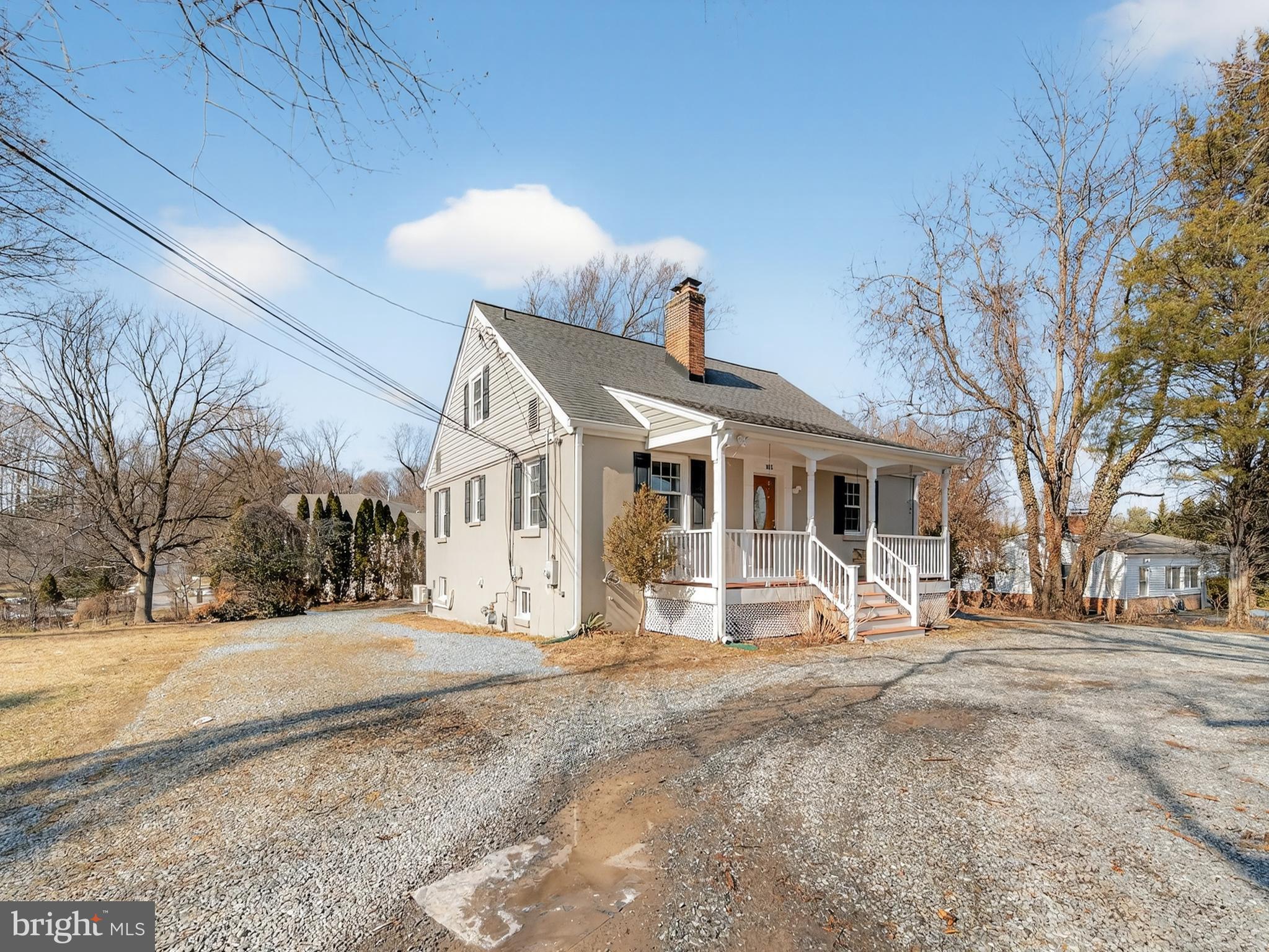 1815 Bonifant Road Silver Spring, MD 20906 - Photo 3 of 49 a view of a house with a yard covered in snow