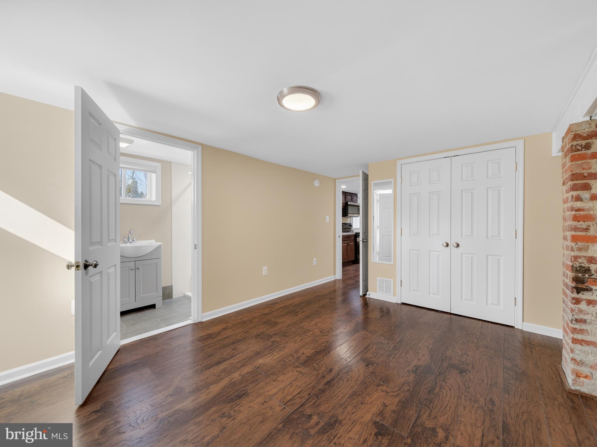 1815 Bonifant Road Silver Spring, MD 20906 - Photo 36 of 49 an empty room with wooden floor and a window