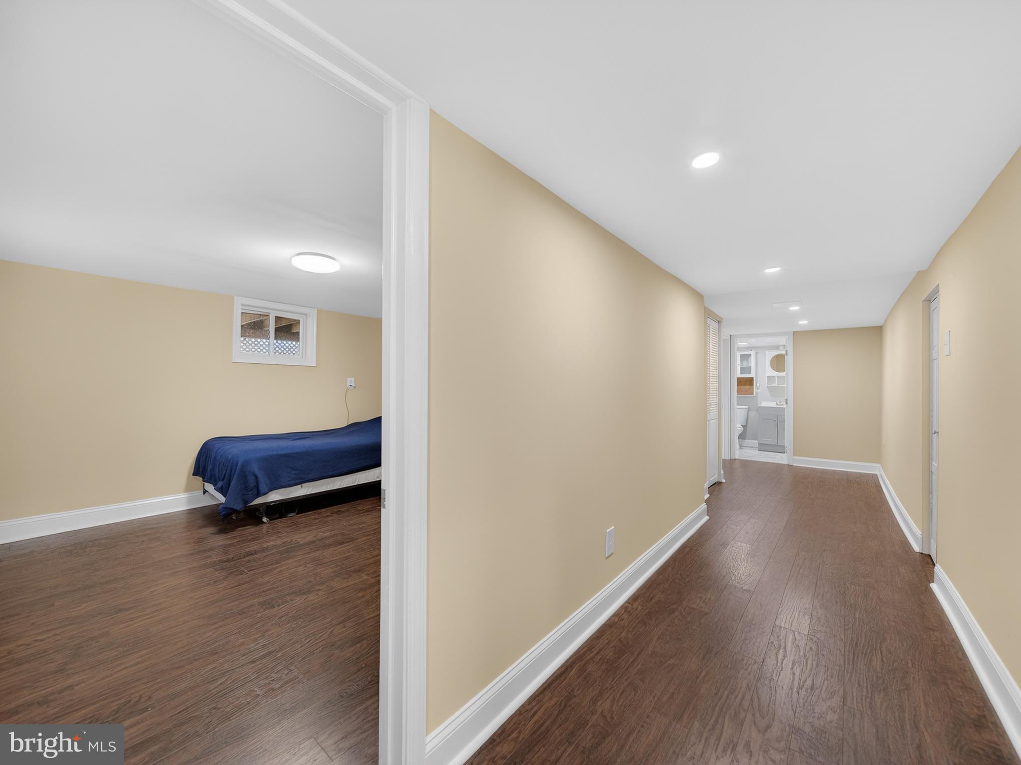 1815 Bonifant Road Silver Spring, MD 20906 - Photo 39 of 49 a view of a livingroom with wooden floor and a ceiling fan