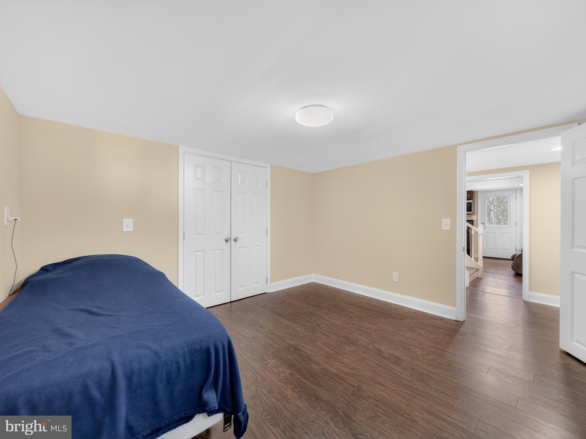 1815 Bonifant Road Silver Spring, MD 20906 - Photo 41 of 49 a view of a bedroom with wooden floor and bathroom