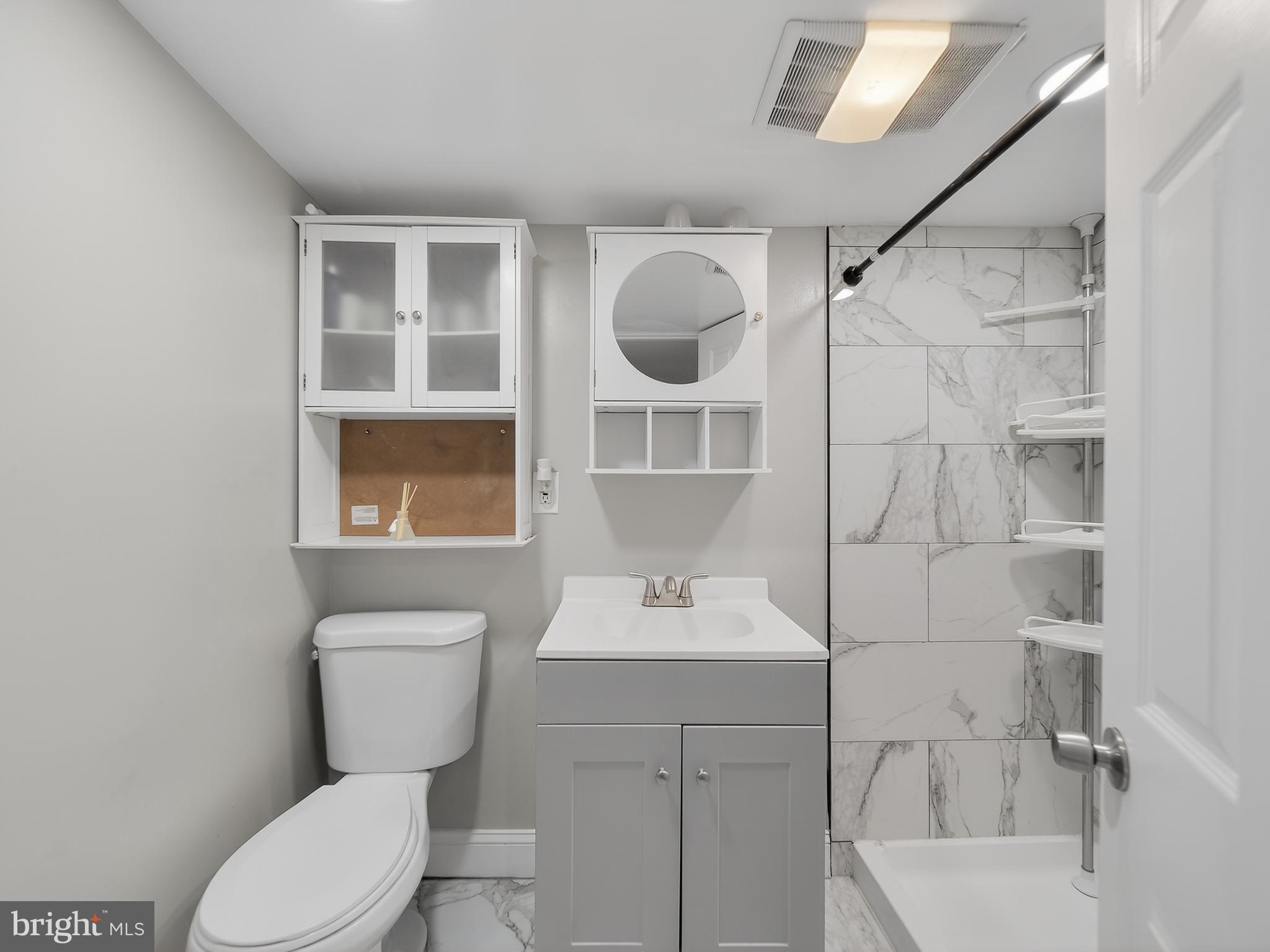 1815 Bonifant Road Silver Spring, MD 20906 - Photo 42 of 49 a bathroom with a sink toilet and shower