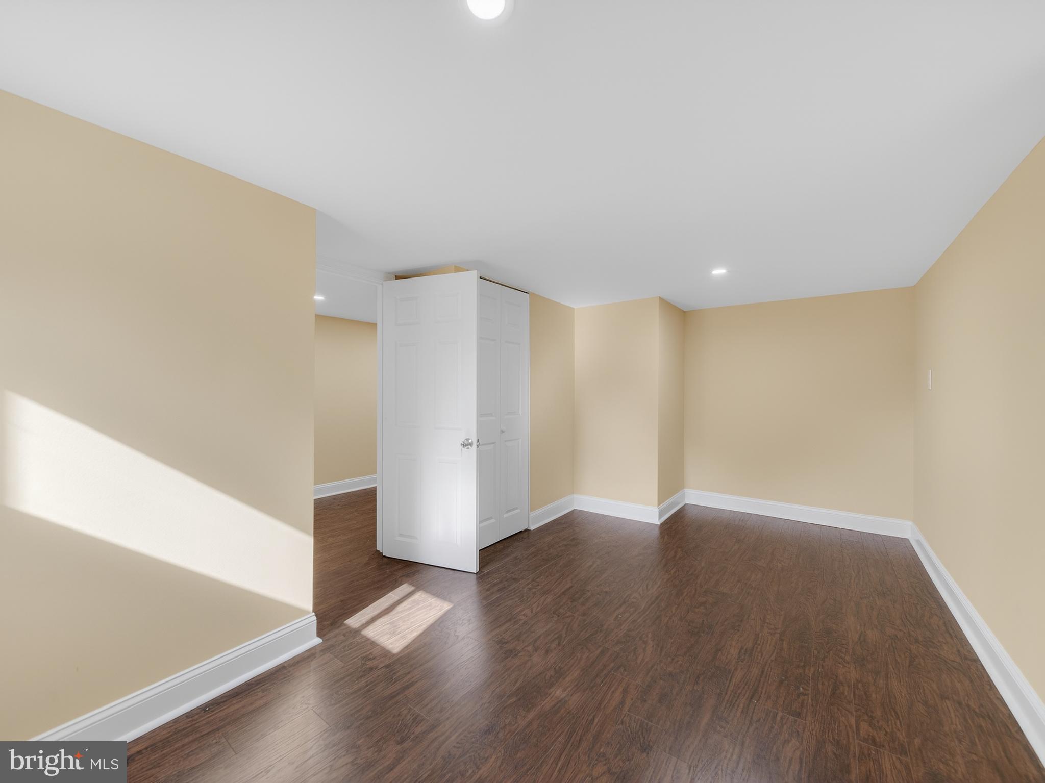 1815 Bonifant Road Silver Spring, MD 20906 - Photo 44 of 49 a view of an empty room with wooden floor