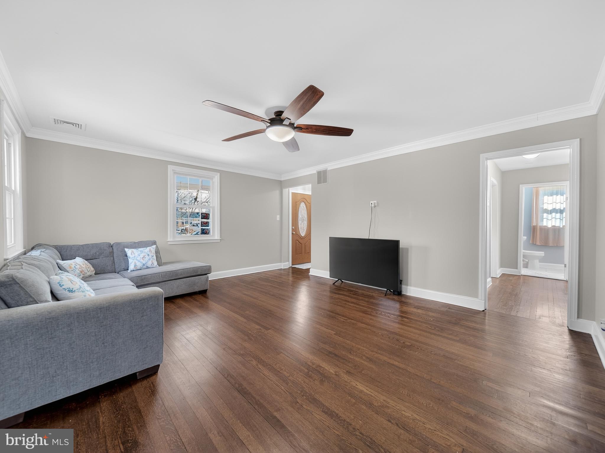1815 Bonifant Road Silver Spring, MD 20906 - Photo 5 of 49 a living room with furniture and a wooden floor