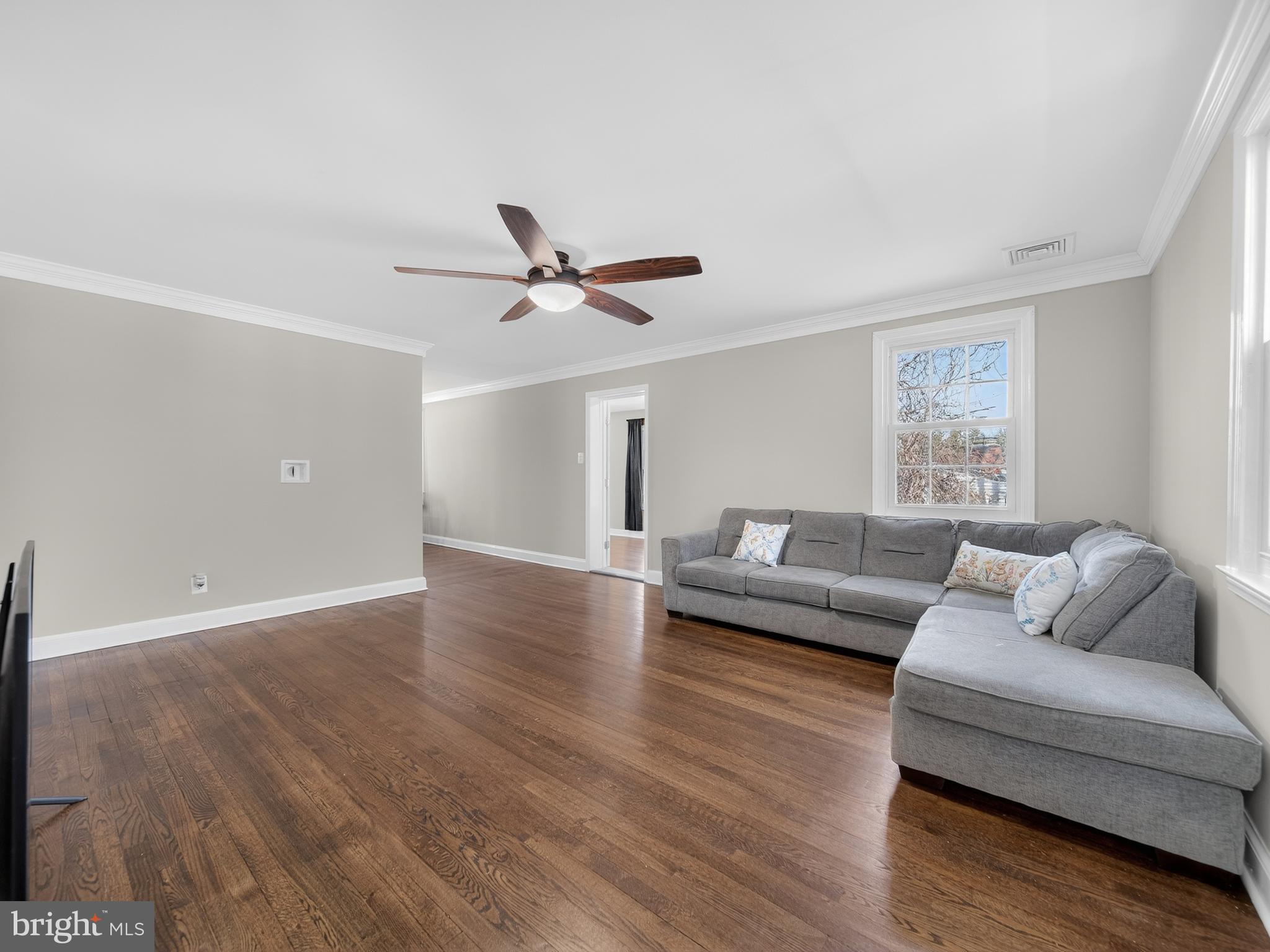 1815 Bonifant Road Silver Spring, MD 20906 - Photo 7 of 49 a living room with furniture and a wooden floor