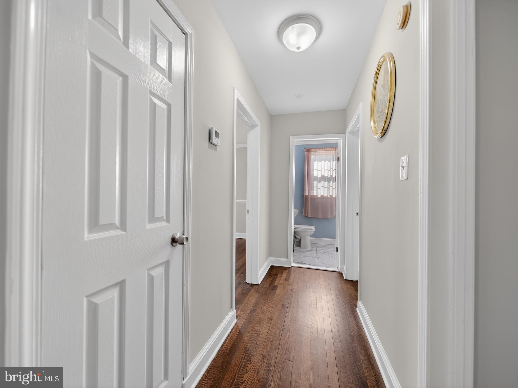 1815 Bonifant Road Silver Spring, MD 20906 - Photo 8 of 49 a view of a hallway with wooden floor