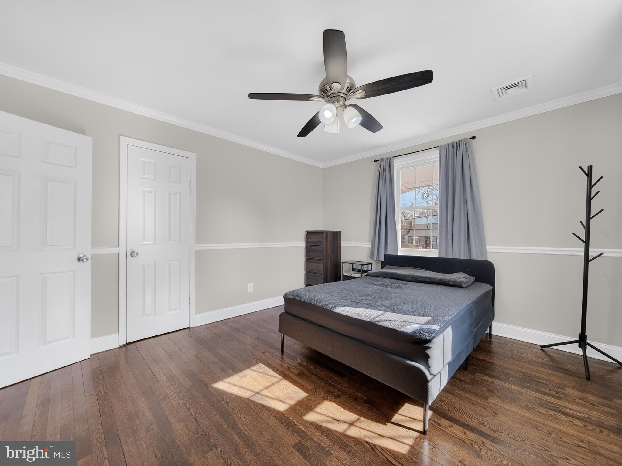 1815 Bonifant Road Silver Spring, MD 20906 - Photo 9 of 49 a living room with a bed furniture and a window