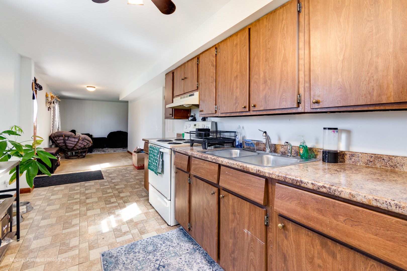 40w791 Big Timber Road Hampshire, IL 60140 - Photo 61 of 67 a kitchen with granite countertop a sink a stove and cabinets