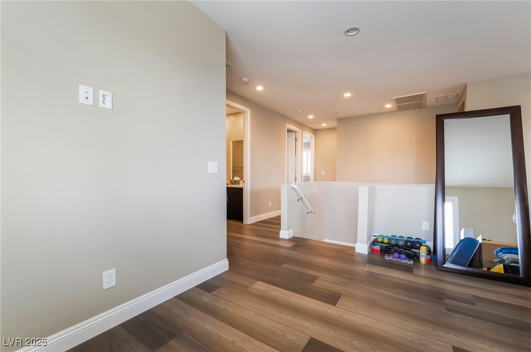 2575 Hazelburn Drive Henderson, NV 89044 - Photo 19 of 65 Unfurnished room with wood finished floors and recessed lighting