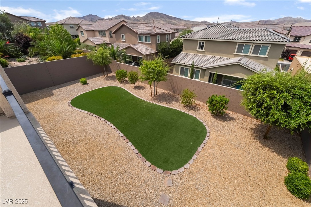 2575 Hazelburn Drive Henderson, NV 89044 - Photo 24 of 65 Fenced backyard with a residential view and a mountain view