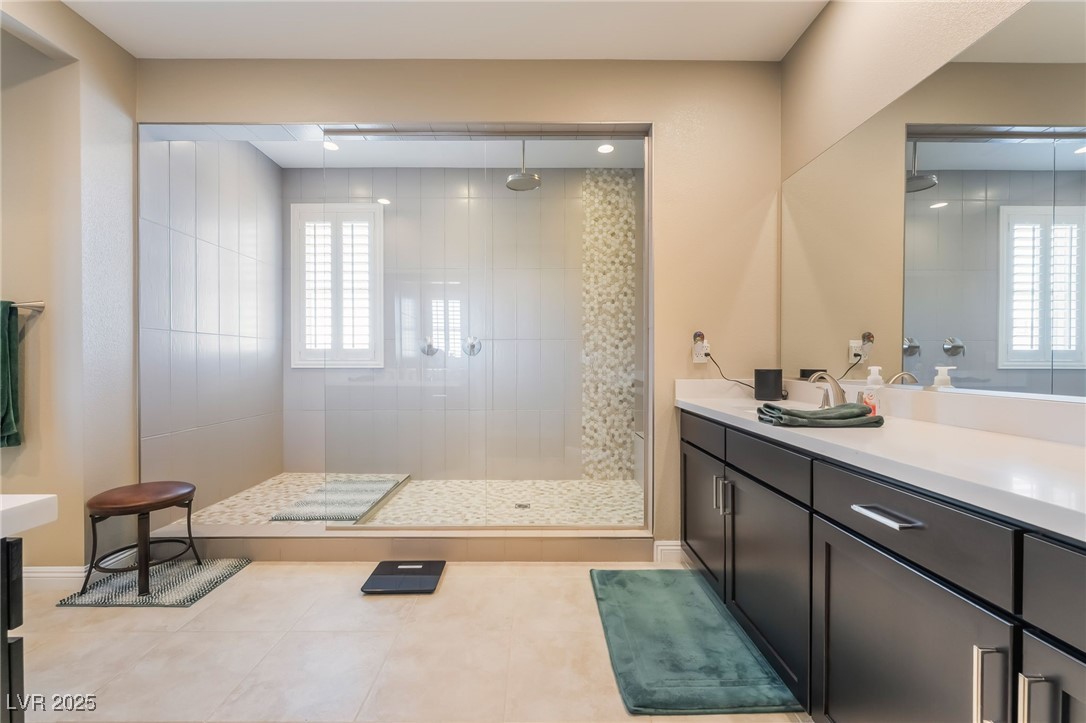 2575 Hazelburn Drive Henderson, NV 89044 - Photo 27 of 65 Full bath with a walk in shower, vanity, and healthy amount of natural light