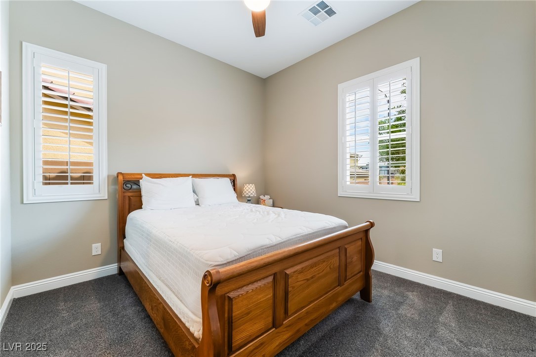 2575 Hazelburn Drive Henderson, NV 89044 - Photo 31 of 65 Bedroom featuring dark colored carpet and ceiling fan