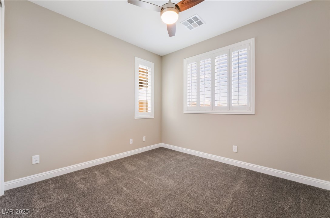 2575 Hazelburn Drive Henderson, NV 89044 - Photo 38 of 65 Carpeted empty room with healthy amount of natural light and a ceiling fan