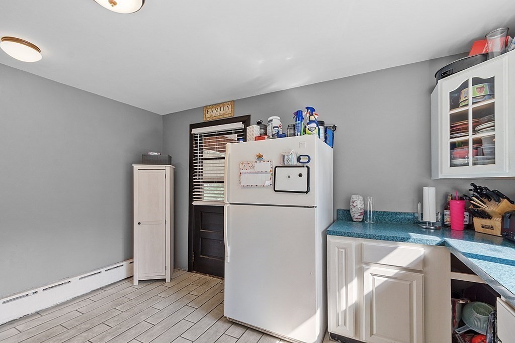 85 Blood Road Charlton, MA 01507 - Photo 11 of 30 a white refrigerator freezer sitting inside of a kitchen