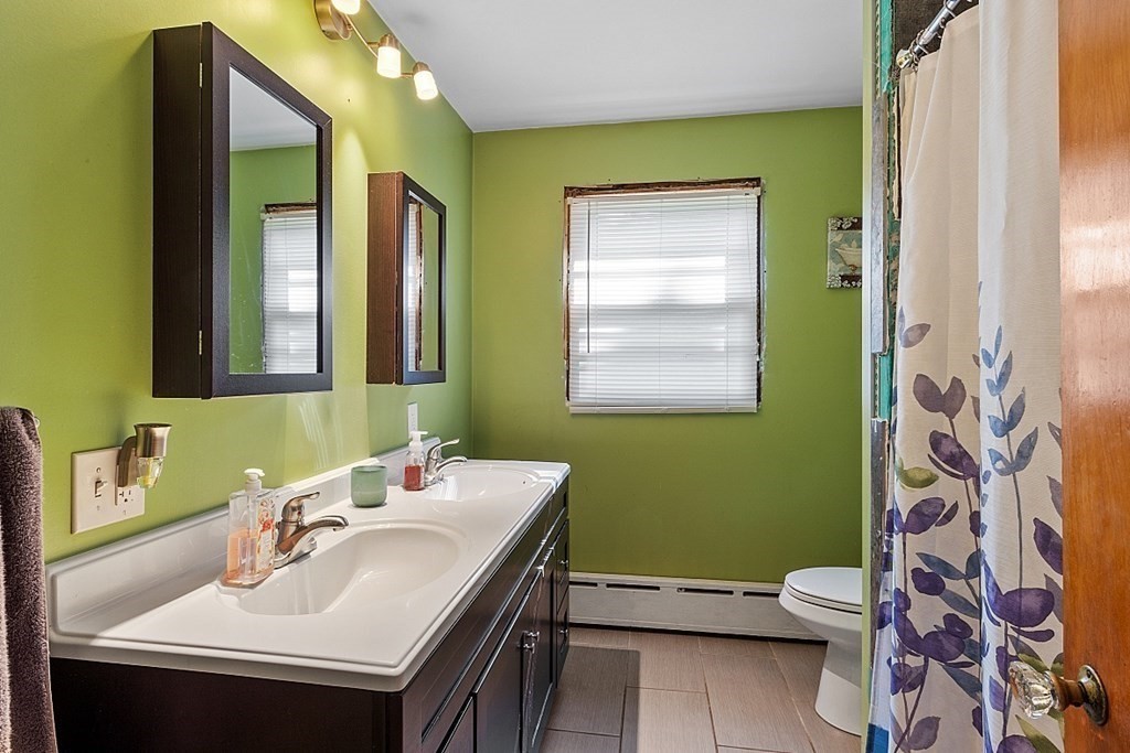 85 Blood Road Charlton, MA 01507 - Photo 12 of 30 a bathroom with a sink mirror and a toilet